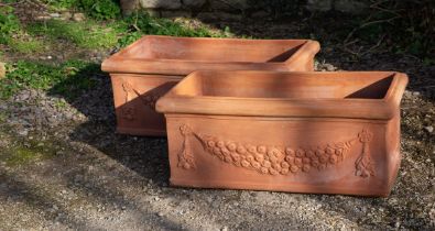 A pair of Tuscan terracotta planters or troughs