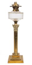 A brass oil lamp modelled as a Corinthian column.