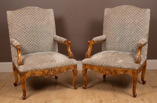 A pair of French Rococo-style open armchairs