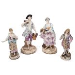 A pair of 19th century Meissen figures together with a pair of German pottery figures