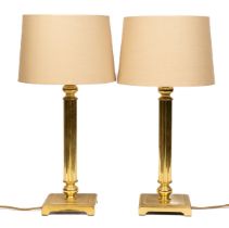 A pair of brass table lamps