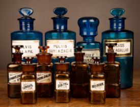 A collection of blue and brown glass chemist's jars