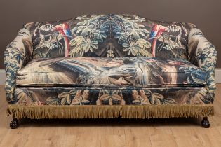 A sofa with verdure tapestry style upholstery