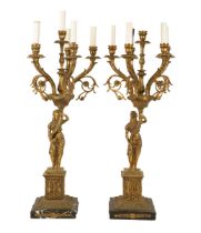 A pair of brass candelabra
