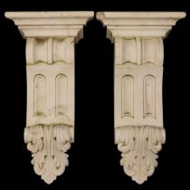A pair of carved marble corbel brackets