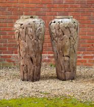 A pair of hardwood decorative garden urns