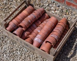 A quantity of old terracotta flower pots