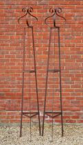 A pair of wrought-iron garden obelisks of plant supports