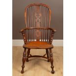 A 19th century yew wood high-back Windsor armchair