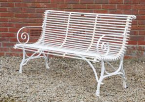 A white-painted French garden bench