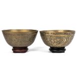 A pair of antique Chinese brass temple bowls