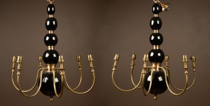 A pair of Pooky "Dunnock" brass and black lacquered wood six-branch chandeliers