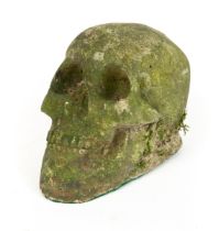 A weathered composite stone skull