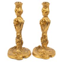 A pair of 19th century French ormolu Rococo style candle sticks