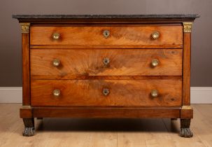 A 19th century Empire style black marble-topped commode