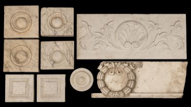 A collection of carved marble chimneypiece tables and plaques