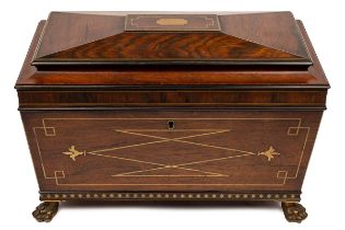 A rosewood tea caddy with brass inlaid banding