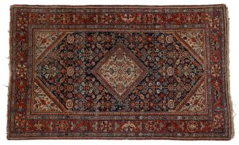 A collection of three rugs