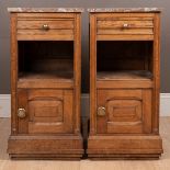 A two Continental oak marble-topped pot cupboards