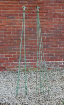 A pair of green painted conical wrought iron obelisks