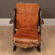 A Liberty & Co. upholstered low chair by William Birch & co.