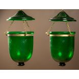 A pair of green cut glass hanging lanterns