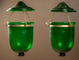 A pair of green cut glass hanging lanterns