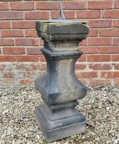 A Victorian carved stone stepped baluster surmounted by a lead sundial