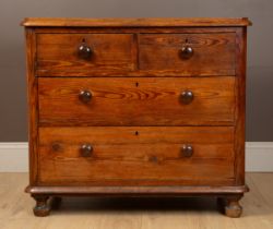 A Victorian pitch pine chest of drawers
