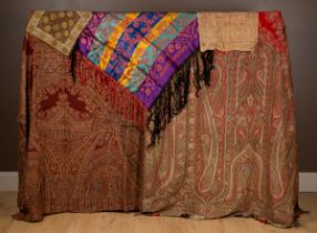 Two Kashmir shawls, a sampler and one other item of textile
