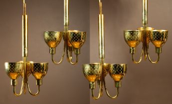 A set of four Kalmar three-branch brass chandeliers