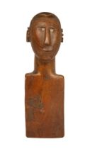 A tribal carved wooden bust