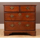 An antique pitch pine chest of drawers