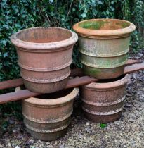 A set of four terracotta planters