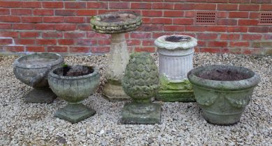 A group of garden planters and ornaments