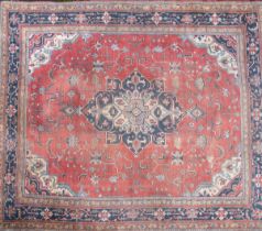 A large hand-woven Oushak style carpet