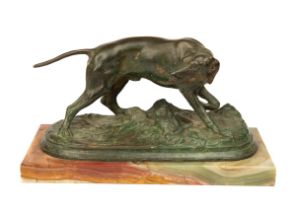 A bronze sculpture of a hound