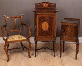 An Edwardian inlaid music cabinet together with an open armchair and a pot cupboard.