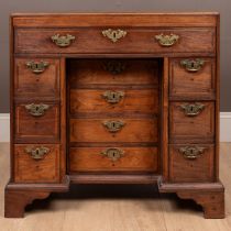 A hardwood possibly Colonial kneehole desk