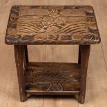 A small Liberty & Co. carved table