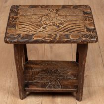 A small Liberty & Co. carved table