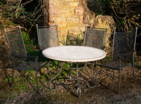A circular garden table with four chairs