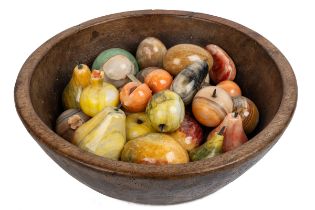 A wooden bowl of hardstone eggs and fruit