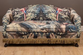 A sofa with verdure tapestry style upholstery