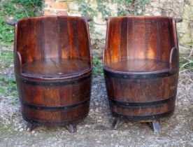 A pair of old oak "barrel" seats