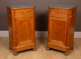 A pair of Continental marble-topped burr maple bedside cabinets