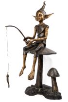 A bronze sculpture of a fishing pixie