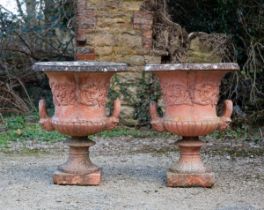A pair of terrracotta coloured cast reconstituted stone campana urns