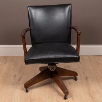 An early 20th century Hillcrest black vinyl adjustable desk chair