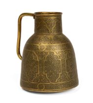 An antique brass Islamic Mameluke style jug